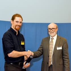 Dr Andrew Parsons receiving the Wollaston Fund award at the Geological Society's 2019 President's Day.